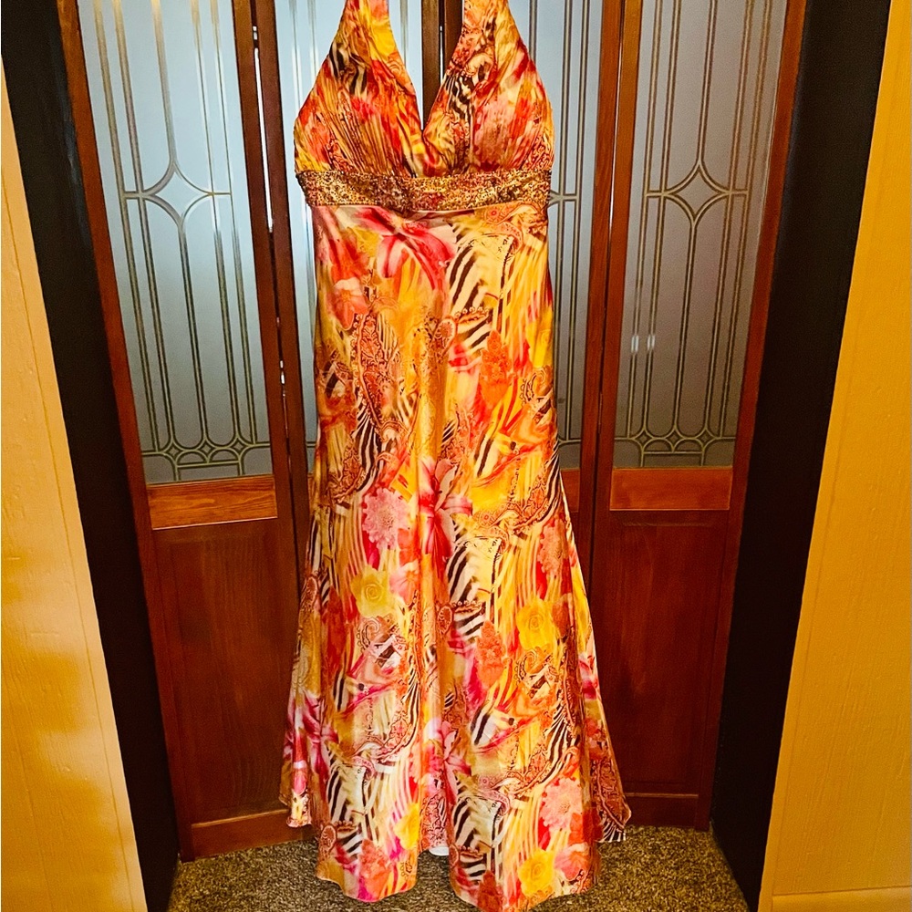 long formal gown that is a bright plethora of multiple colors and sparkles!